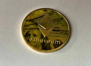 round gold colored ethereum ornament
